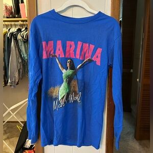 MARINA Man’s World Tour Blue Long Sleeve Tee